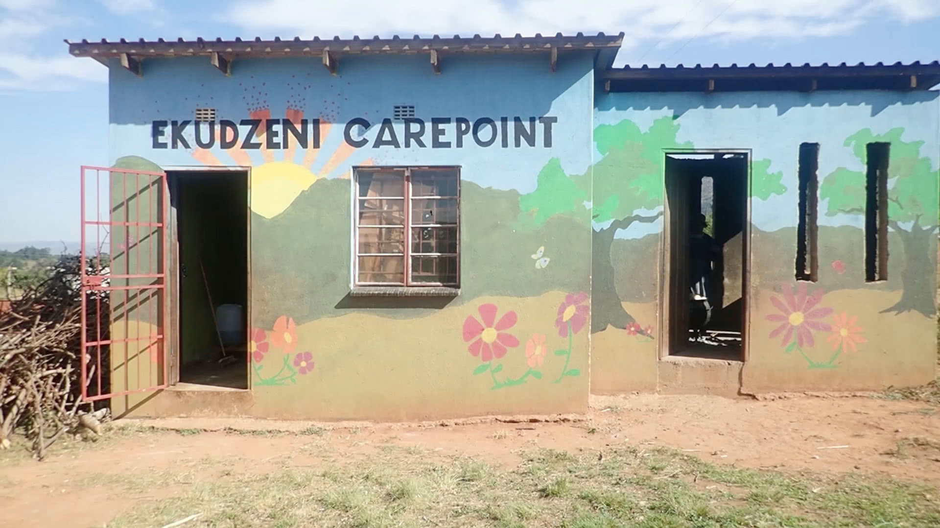cooks serving children at Ekudzeni CarePoint in Eswatini Africa